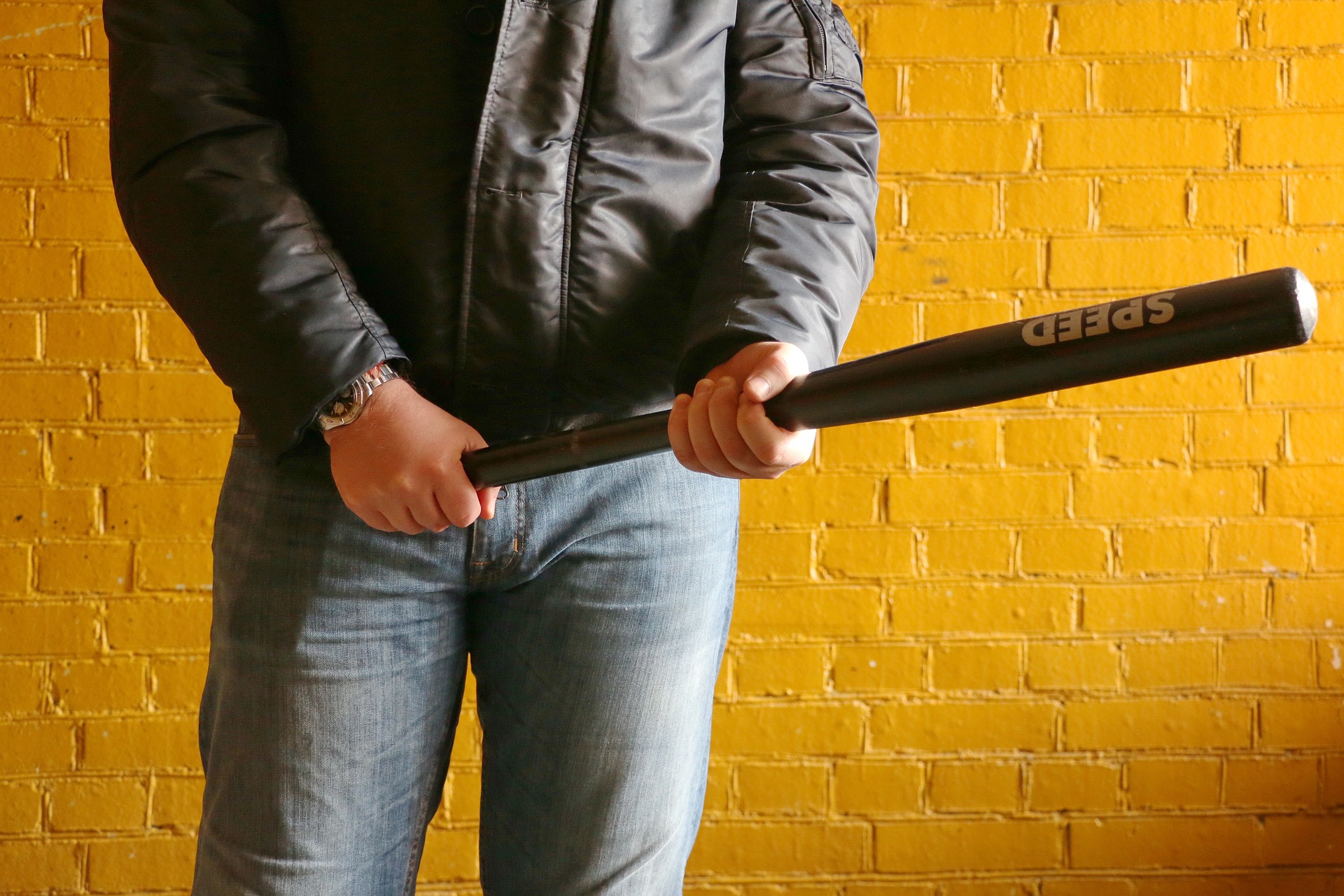 A mugger with a baseball bat