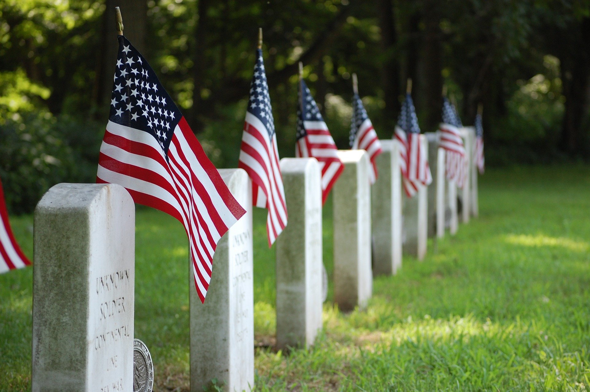 military graves with flags